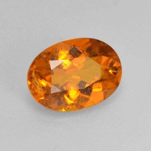 0.82 ct Orange Clinohumite Stone, Natural Clinohumite in Oval Facet Shape for Sale
