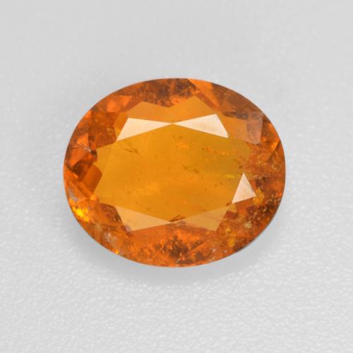 1.45 ct Orange Clinohumite Gemstone, Clinohumite Gem in Oval Facet Shape for Sale.