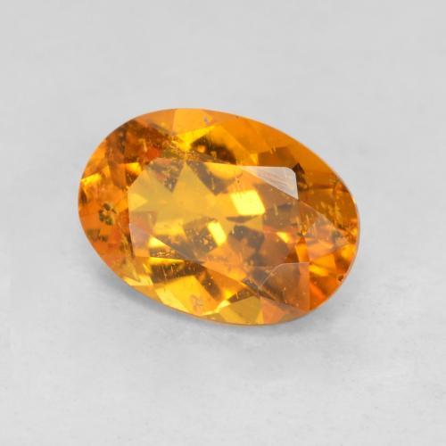 0.85 ct Orange Clinohumite Stone, Natural Clinohumite in Oval Facet Shape for Sale