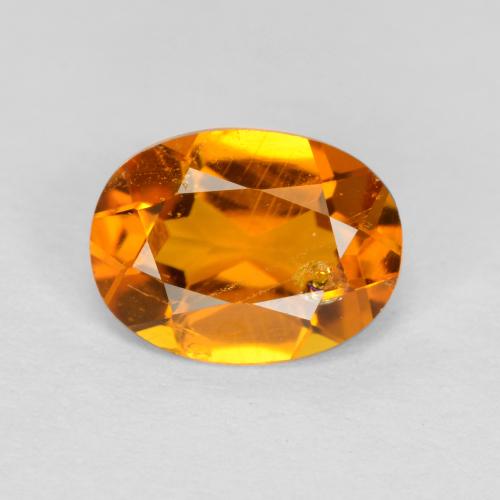 0.89 ct Orange Clinohumite Gemstone, Clinohumite Gem in Oval Facet Shape for Sale.