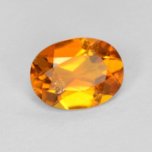 0.89 ct Orange Clinohumite Stone, Natural Clinohumite in Oval Facet Shape for Sale