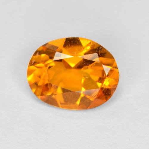 0.68 ct Orange Clinohumite Gemstone, Clinohumite Gem in Oval Facet Shape for Sale.