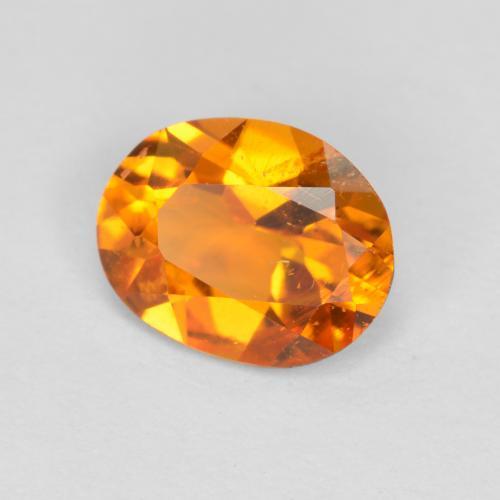 0.68 ct Orange Clinohumite Stone, Natural Clinohumite in Oval Facet Shape for Sale