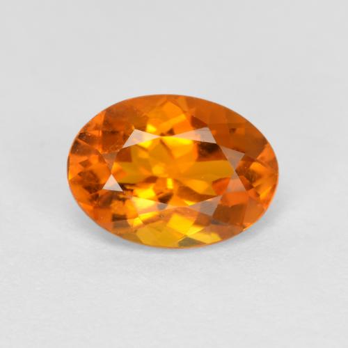 0.74 ct Orange Clinohumite Gemstone, Clinohumite Gem in Oval Facet Shape for Sale.