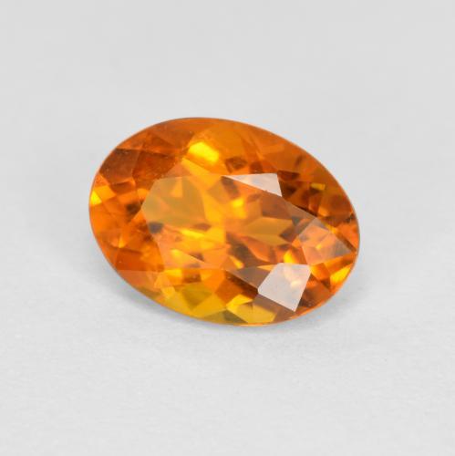 0.74 ct Orange Clinohumite Stone, Natural Clinohumite in Oval Facet Shape for Sale