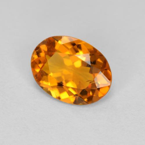 0.66 ct Orange Clinohumite Stone, Natural Clinohumite in Oval Facet Shape for Sale