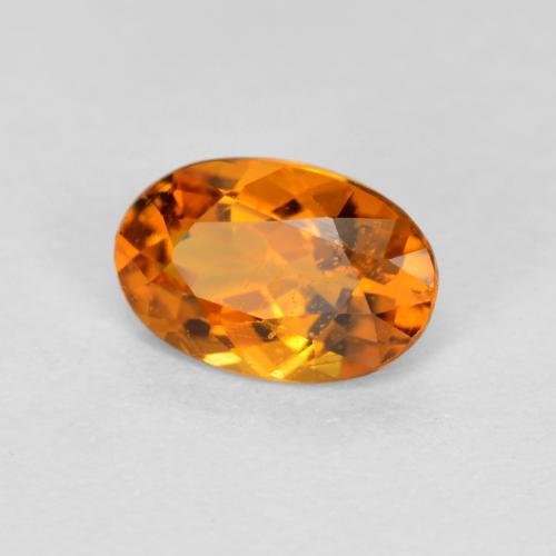 0.41 ct Orange Clinohumite Stone, Natural Clinohumite in Oval Facet Shape for Sale
