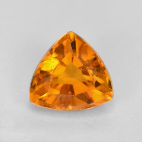 0.59 ct Orange Clinohumite Gemstone, Clinohumite Gem in Trillion Facet Shape for Sale.