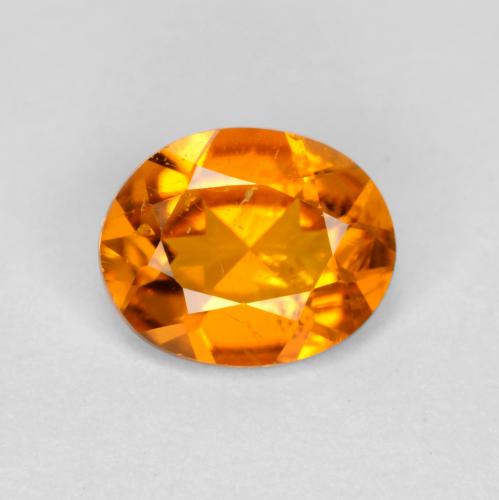 0.54 ct Orange Clinohumite Gemstone, Clinohumite Gem in Oval Facet Shape for Sale.
