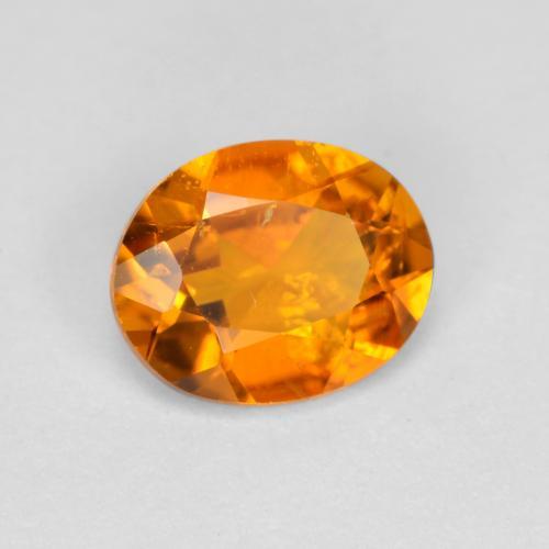 0.54 ct Orange Clinohumite Stone, Natural Clinohumite in Oval Facet Shape for Sale