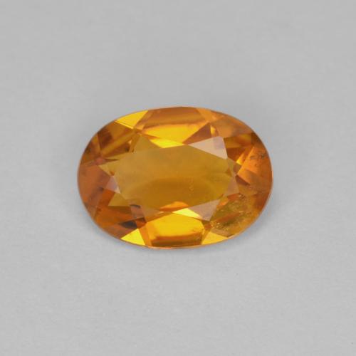 0.90 ct Orange Clinohumite Gemstone, Clinohumite Gem in Oval Facet Shape for Sale.