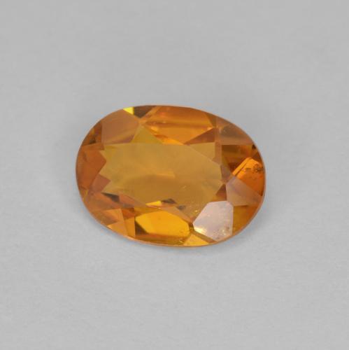 0.90 ct Orange Clinohumite Stone, Natural Clinohumite in Oval Facet Shape for Sale