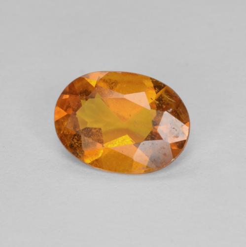 0.94 ct Orange Clinohumite Stone, Natural Clinohumite in Oval Facet Shape for Sale
