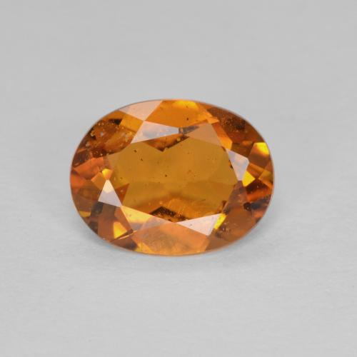 Medium-Dark Orange Klinohumit Edelstein - 1.2ct Oval facettiert (ID: 604655)