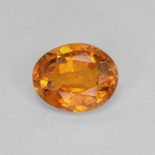 Medium Orange Klinohumit Edelstein - 0.9ct Oval facettiert (ID: 604657)