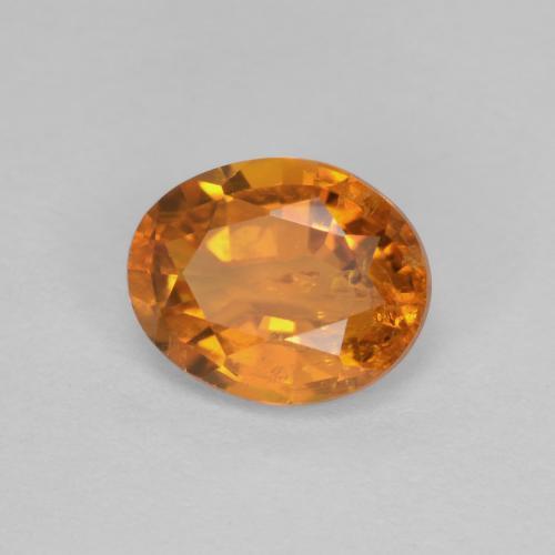 0.91 ct Orange Clinohumite Stone, Natural Clinohumite in Oval Facet Shape for Sale