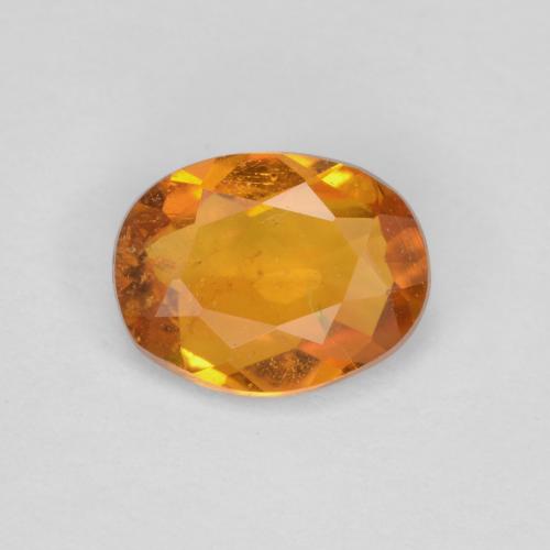 0.65 ct Orange Clinohumite Gemstone, Clinohumite Gem in Oval Facet Shape for Sale.