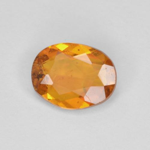 0.65 ct Orange Clinohumite Stone, Natural Clinohumite in Oval Facet Shape for Sale