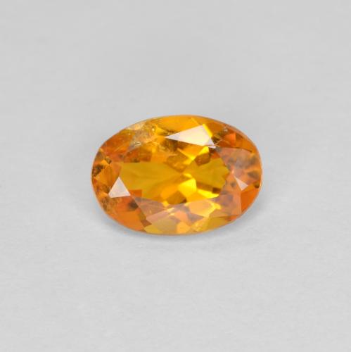 Aprikose Orange Klinohumit Edelstein - 0.6ct Oval facettiert (ID: 604901)