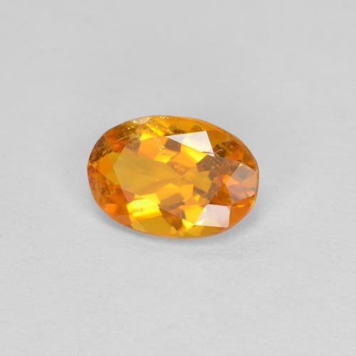 0.60 ct Orange Clinohumite Stone, Natural Clinohumite in Oval Facet Shape for Sale
