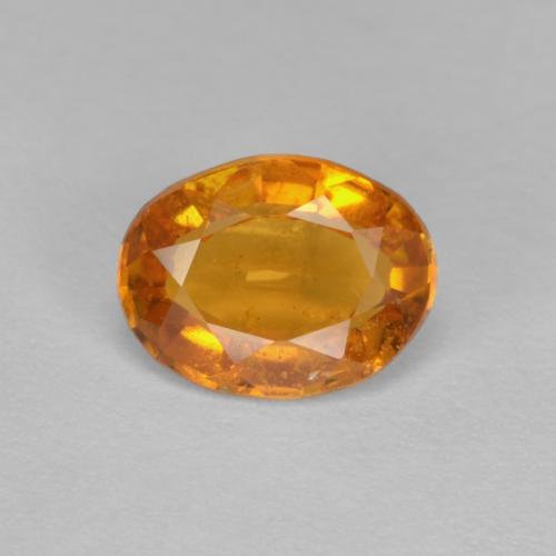 Aprikose Orange Klinohumit Edelstein - 0.9ct Oval facettiert (ID: 605030)