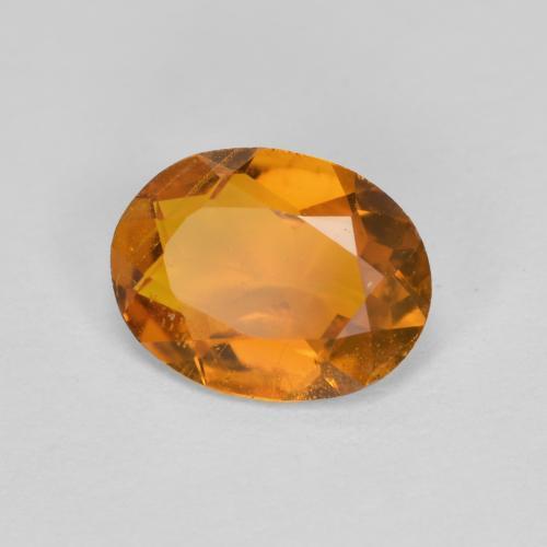 1.34 ct Orange Clinohumite Stone, Natural Clinohumite in Oval Facet Shape for Sale