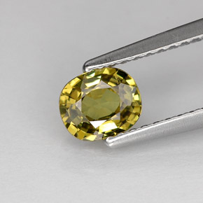 0.62 ct Green Demantoid Garnet Gemstone, Demantoid Garnet Gem in Oval Facet Shape for Sale.