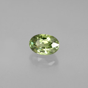 0.56 ct Green Demantoid Garnet Stone, Natural Demantoid Garnet in Oval Facet Shape for Sale