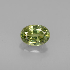 0.68 ct Green Demantoid Garnet Gemstone, Demantoid Garnet Gem in Oval Facet Shape for Sale.