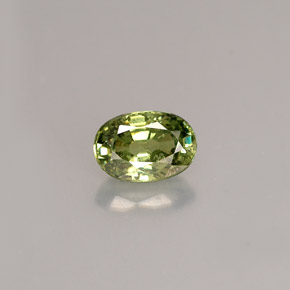 0.68 ct Green Demantoid Garnet Gemstone, Demantoid Garnet Gem in Oval Facet Shape for Sale.