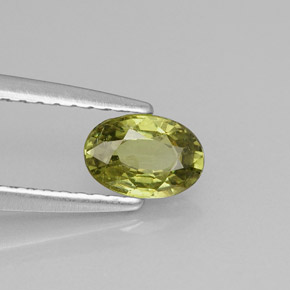 0.57 ct Green Demantoid Garnet Stone, Natural Demantoid Garnet in Oval Facet Shape for Sale