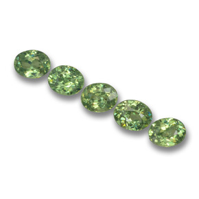 0.4ct Oval Facet Golden Green Demantoid Garnet Gem for sale 0.4ct Oval Facet Golden Green Demantoid Garnet Gem (ID: 458477)