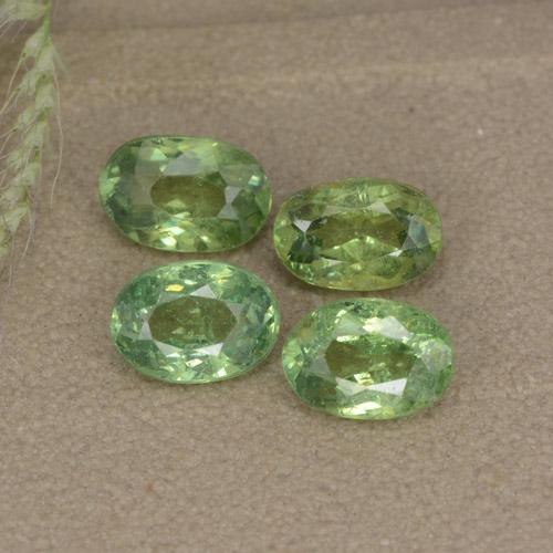 0.7ct Oval Facet Golden Green Demantoid Garnet for sale thumb image of 0.7ct Oval Facet Golden Green Demantoid Garnet (ID: 478607)