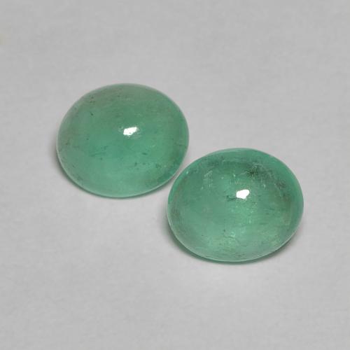 4.9 x 4mm Matching Oval Emerald Pair - Weight 0.67ct total / avg. 0.34ct each, Natural Gemstone, Light Cool Green Color in Transparent Clarity, Mohs Hardness 7.5 - 8 suitable for daily wear jewelry, Stone of Successful Love, Photo A