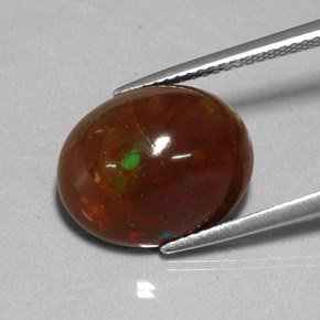 6.48 ct Multicolor Fire Opal Gemstone, Fire Opal Gem in Oval Cabochon Shape for Sale.