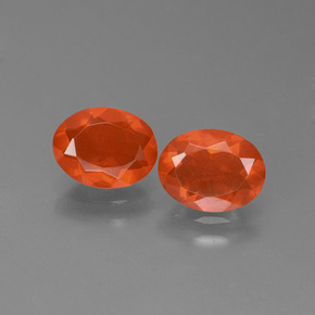 Deep Reddish Orange Fire Opal Gem - 0.6ct Oval Facet (ID: 450475)