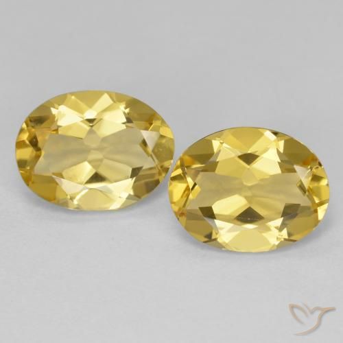 Par de Berilo Dorado Ovalada a juego de 9,2 x 7mm - Peso 3,44 ct en total / promedio. 1,72 ct cada uno, color Dorado claro en claridad vvs-vs, piedra preciosa natural No tratado, dureza de Mohs 7.5 - 8 Adecuado para joyas de uso diario, Photo A