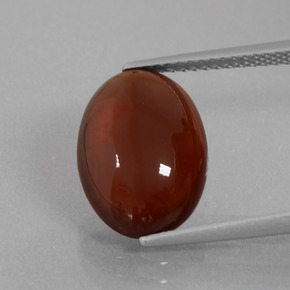 7.49 ct Orange Hessonite Garnet Gemstone, Hessonite Garnet Gem in Oval Cabochon Shape for Sale.