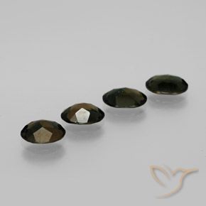 Kornerupine Gemstones in 7.2 x 5.4 mm Size for Sale, Kornerupine Stones in Dark Green Color