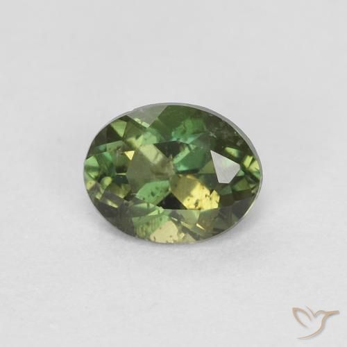 0.31 ct Green Kornerupine Gemstone, Kornerupine Gem in Oval Facet Shape for Sale.