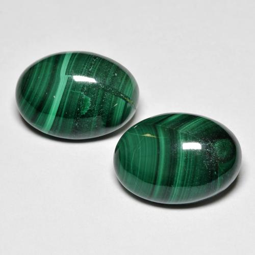 2 pezzi Malachite taglio ovale abbinati di dimensioni 14 x 10mm, peso 15,17 ct totali / media. 7,59 ct ciascuno, Verde scuro in purezza Opaque, pietra preziosa naturale non trattati, durezza Mohs 3,5 - 4, Photo A