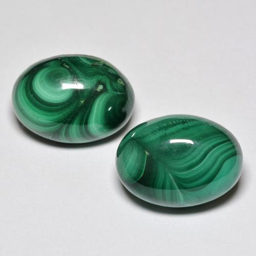 Coppia Malachite Ovale abbinata 13,9 x 10,1mm - Peso 17,47 ct totali / media. 8,74 ct ciascuno, pietra preziosa naturale non trattati, colore Verde multicolore in purezza Opaque, durezza Mohs 3,5 - 4, Photo A