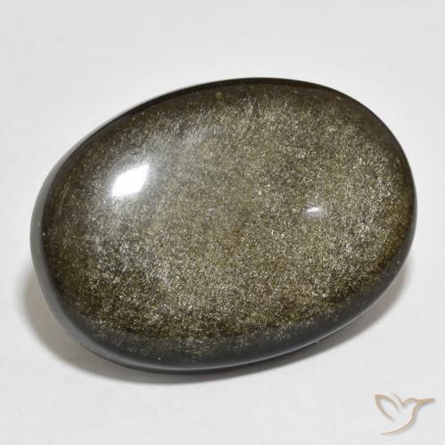 Obsidiana Dorado Cabujón Óvalo de 22.54 ct de Estados Unidos, dimensión 26,7 x 19,4mm, piedra preciosa natural No tratado, claridad Opaco, Obsidiana de 1 pieza en color Negro con brillo dorado, dureza Mohs de 5 - 5.5, Photo A