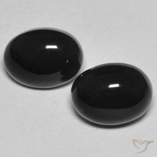 Coppia abbinata di 8 x 6mm taglio ovale Nero Onice , peso di 2,51 ct totali / media. 1,26 ct ciascuno, coppia Onice abbinata in purezza Opaque in colore Nero, pietra preziosa naturale Tinto, durezza Mohs 6,5 - 7 adatto per gioielli da indossare ogni giorno, Photo A
