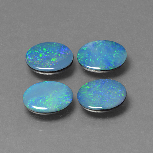 4-teiliges Set ovaler mehrfarbiger Opal-Dublette aus Australian - Gewicht 2,21 ct gesamt / Durchschn. je 0,55ct, Größe 6,9 x 4,9mm, Farbe: Mehrfarbig, Mohs-Härte 5,5 - 6,5, Photo A
