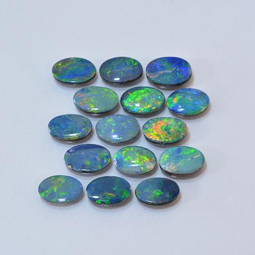 Set aus 15 Stück ovaler Opal-Dublette in mehrfarbiger Farbe aus Australian - Größe 6,4 x 4,2mm, Gewicht 5,17 ct gesamt / Durchschn. je 0,34 ct, Farbe: Mehrfarbig, Mohs-Härte 5,5 - 6,5, Photo A