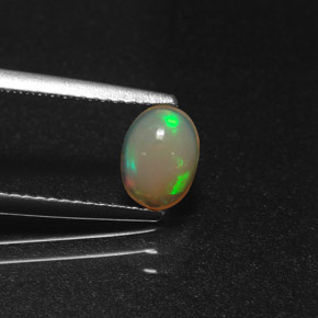 0.58 ct Multicolor Opal Gemstone, Opal Gem in Oval Cabochon Shape for Sale.