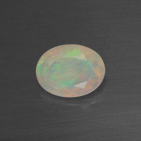 0.65 ct Multicolor Opal Gemstone, Opal Gem in Oval Facet Shape for Sale.