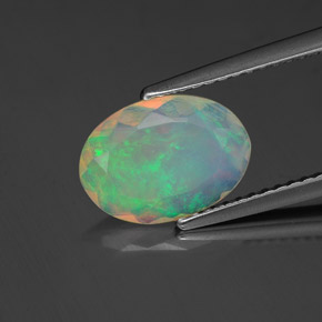 1.06 ct Multicolor Opal Gemstone, Opal Gem in Oval Facet Shape for Sale.