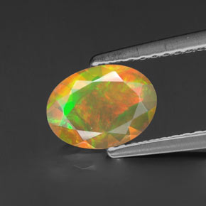 0.69 ct Multicolor Opal Gemstone, Opal Gem in Oval Facet Shape for Sale.